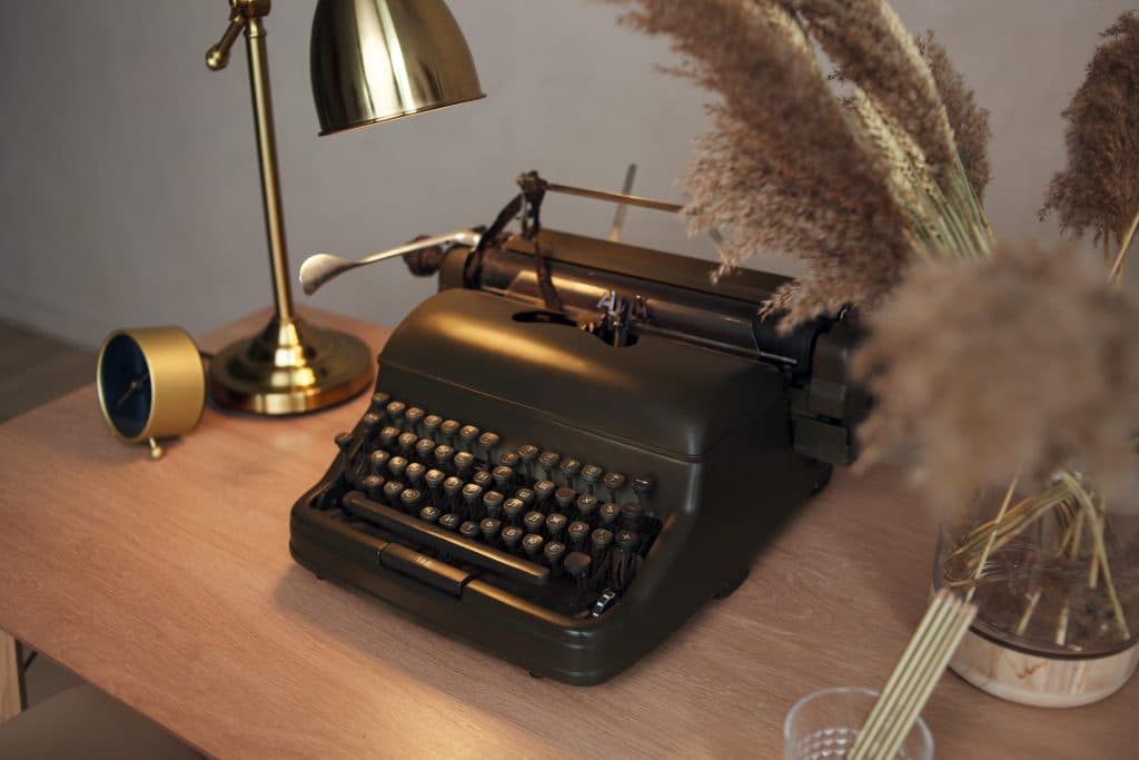 A typewriter on a writer's desk